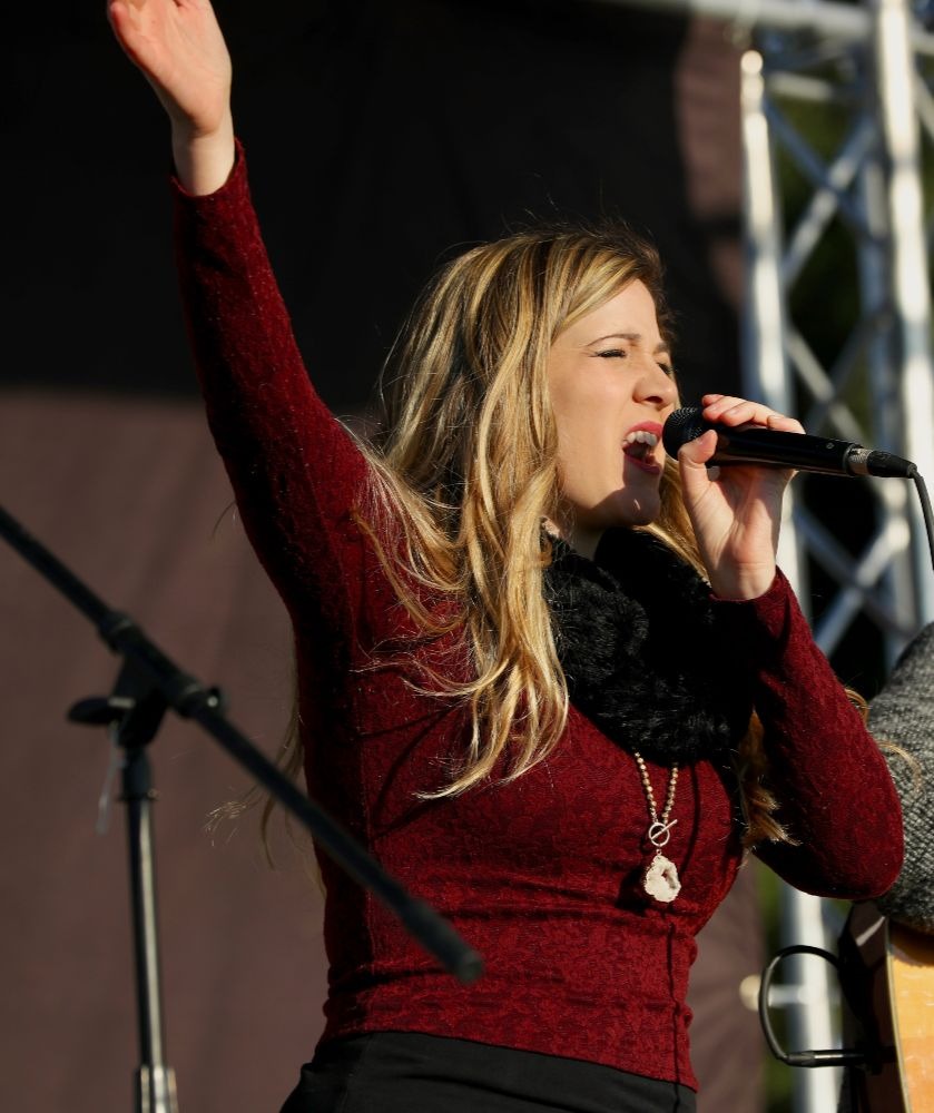 Ashley Jordan singing at a concert